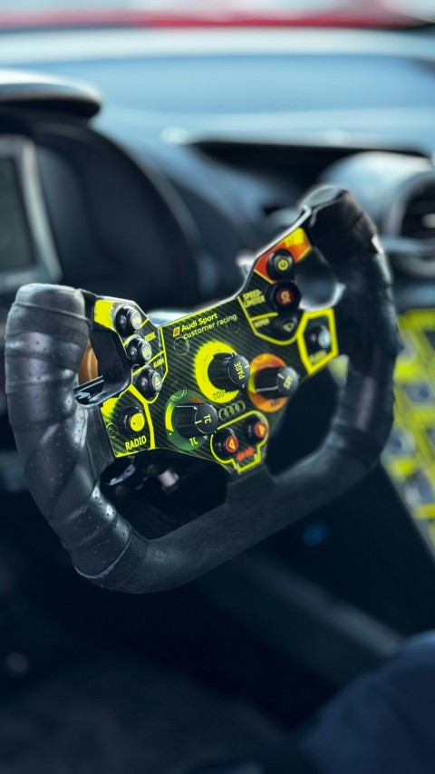 a close up of a steering wheel in a car