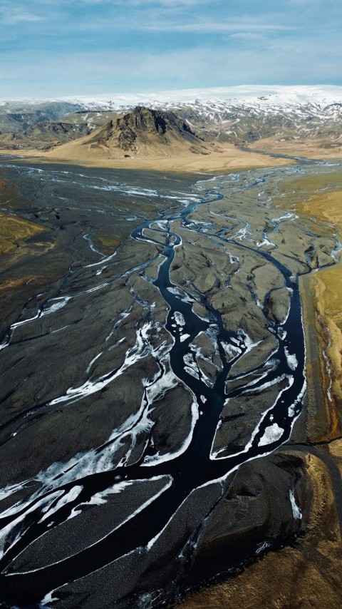 an aerial view of a river running through a valley