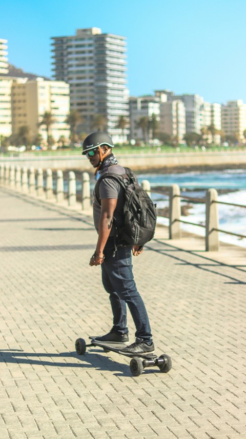 a man riding a skateboard cMi