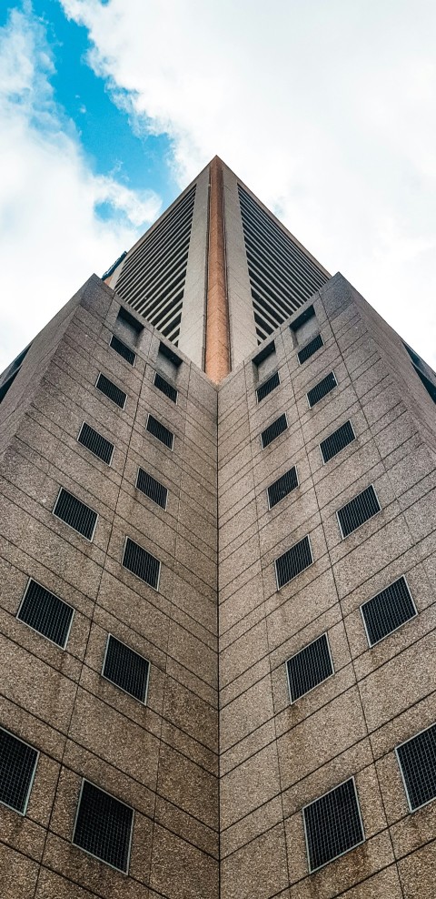 brown concrete building under blue sky during daytime