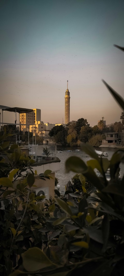 a view of a city with a clock tower in the distance