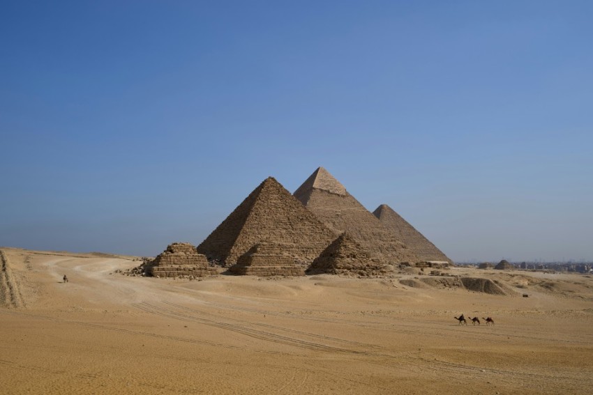 two large stone pillars with writing on them