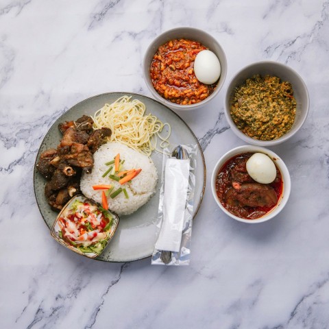 a plate of food on a marble table