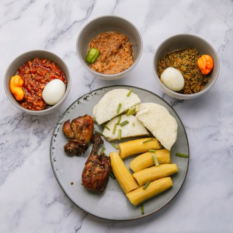 a plate of food that includes meat rice and beans