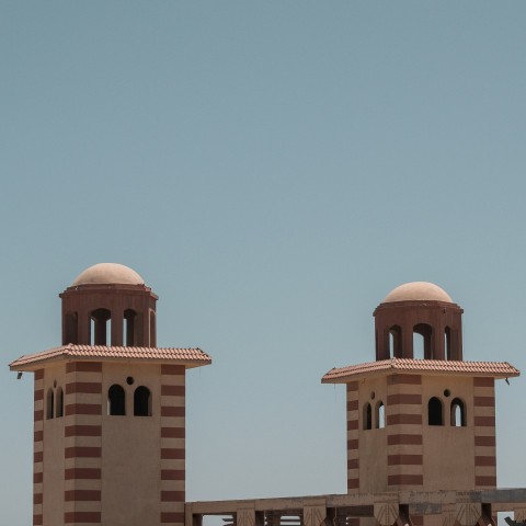 brown concrete building under blue sky during daytime