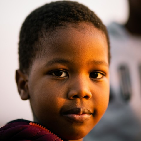 boy in red and white shirt