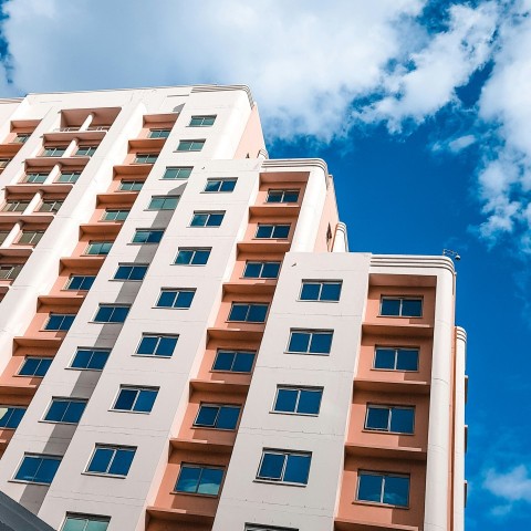 white and brown concrete building under blue sky during daytime l