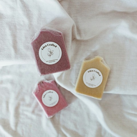 red and white plastic containers on pink textile