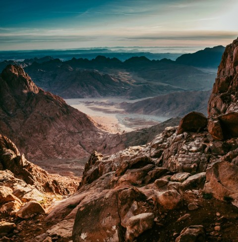 aerial photography of desert under blue and white sky during daytime