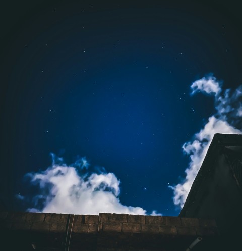 worms eye view of blue sky and white clouds