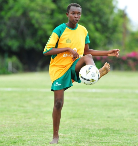 boy playing soccer ball 9e