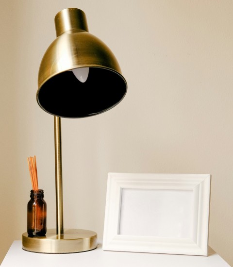 brass and white table lamp