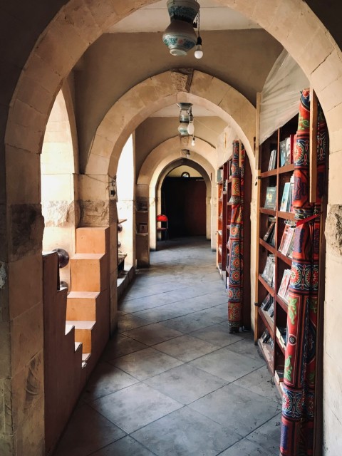 brown wooden shelves in a library