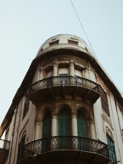 an old building with a balcony and balconies