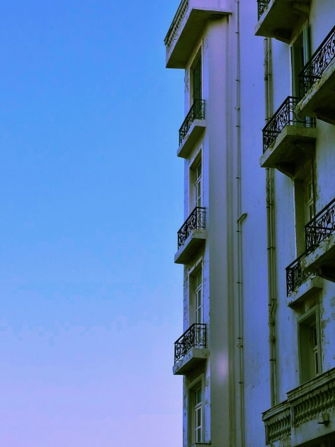 a tall building with balconies and balconies on the balconies