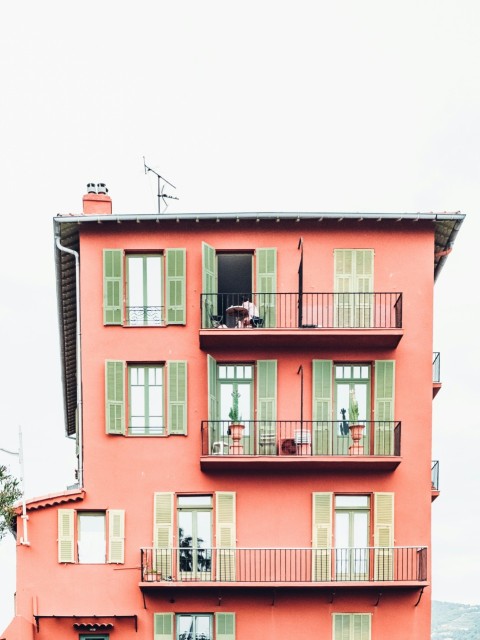 orange and green 4 storey building