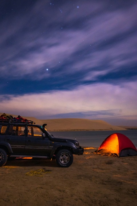 a body of water surrounded by desert land