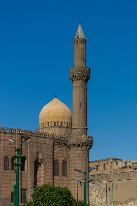 brown concrete dome building under blue sky during daytime