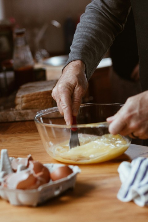 person holding sliced lemon fruit UN