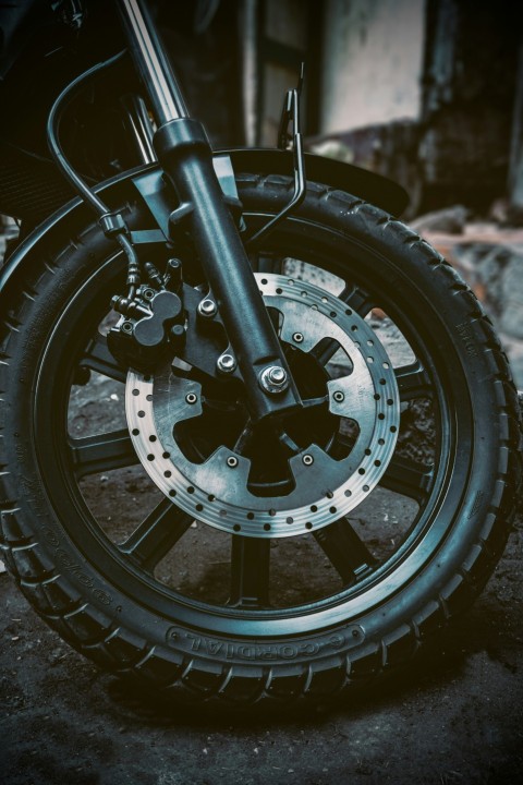 a close up of a motorcycle tire on a street