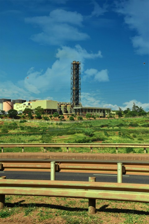 a view of a large building with a tower in the background