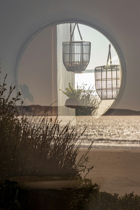 a reflection of two baskets in a mirror