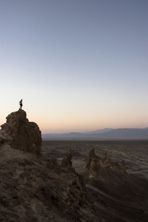 man standing on rock