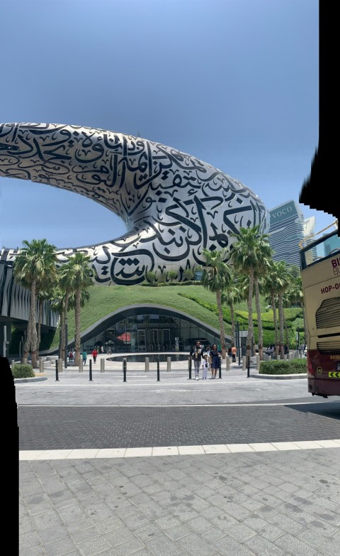 a double decker bus parked in front of a building