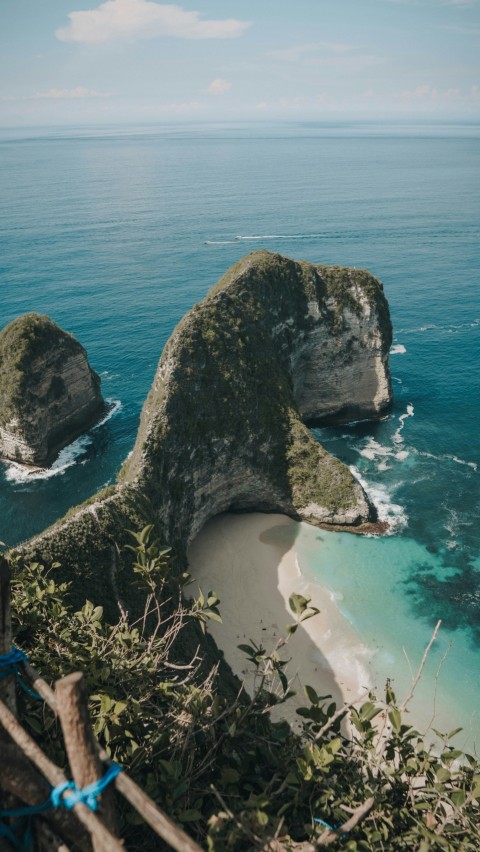 black rock formation on sea shore during daytime