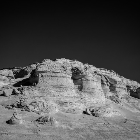 a black and white photo of a rocky outcropping